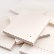 Quadratische Notizblöcke von Alexandra Renke mit Raster-, Punkt- und Linienmustern - ideal für Bullet Journals -, darunter auch einer mit einem kleinen roten Pluszeichen.