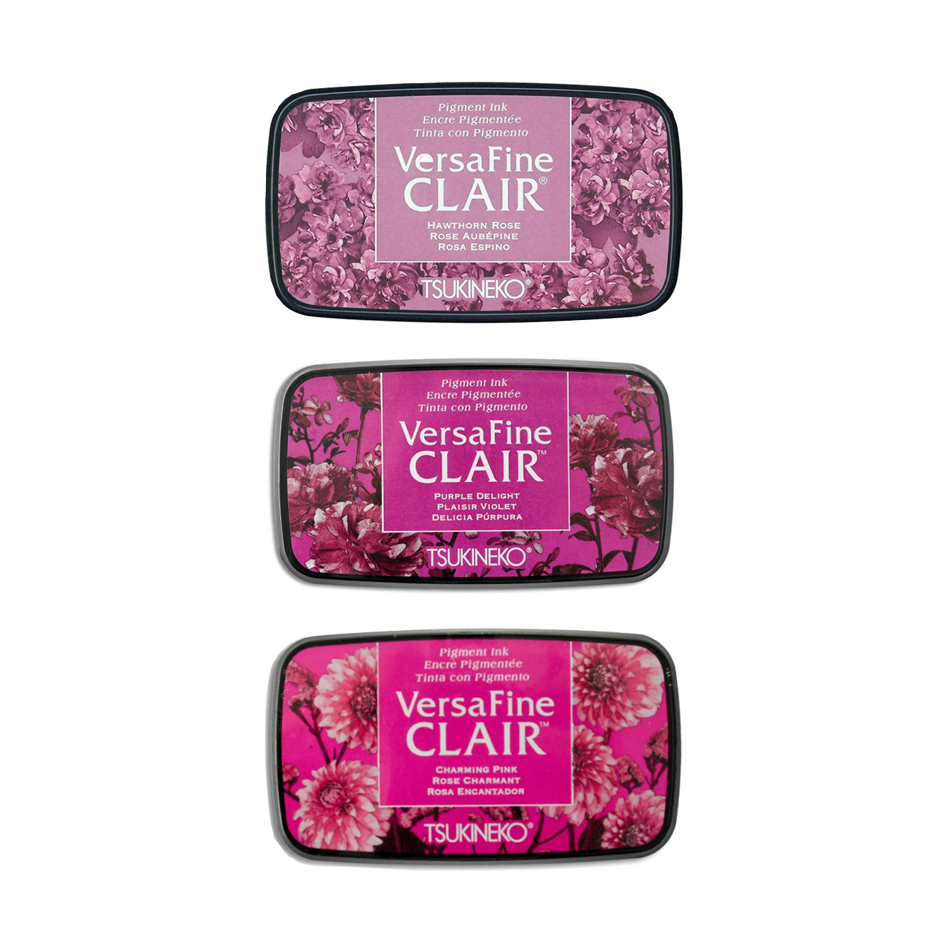 Drei Tsukineko VersaFine Clair Pigment-Tinte Stempelkissen in verschiedenen Rosatönen mit floralen Motiven auf den Deckeln - ideal zum detailreichen Stempeln.