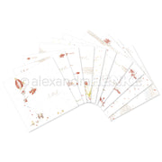 Ein skurriles Set illustrierter Briefbögen mit roten und goldenen Motiven von Alexandra Renke - perfekt, um sich inspirieren zu lassen oder Ihr Kreativ-Bundle mit Charme zu ergänzen.