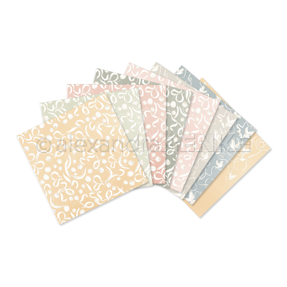 Acht pastellfarben gemusterte Papierbögen von Alexandra Renke, jeder mit einem einzigartigen weißen Blumen- oder Blattmotiv - ideal als Inspiration für Ihr nächstes Kreativitäts-Bundle oder zum Mischen und Kombinieren in Ihren Kollektionen.