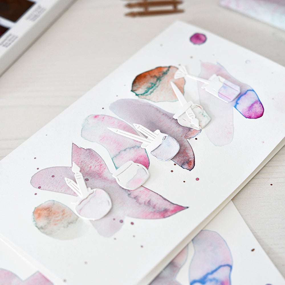 Aquarellmalerei mit abstrakten Pastellformen und weißen ausgeschnittenen Stiften, Tintenflaschen und Motivstanze Mini Marmeladengläser von Alexandra Renke - ideal für Stanzen für Designpapiere oder Dies für DieCut Systeme auf Papier.