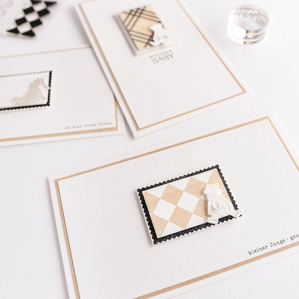 Die minimalistischen Grußkarten von Alexandra Renke zeichnen sich durch beigefarbene und schwarze geometrische Karomuster mit kleinen ausgeschnittenen Formen aus - ideal zum Kombinieren mit klaren Stempel- oder Photopolymer-Verzierungen.