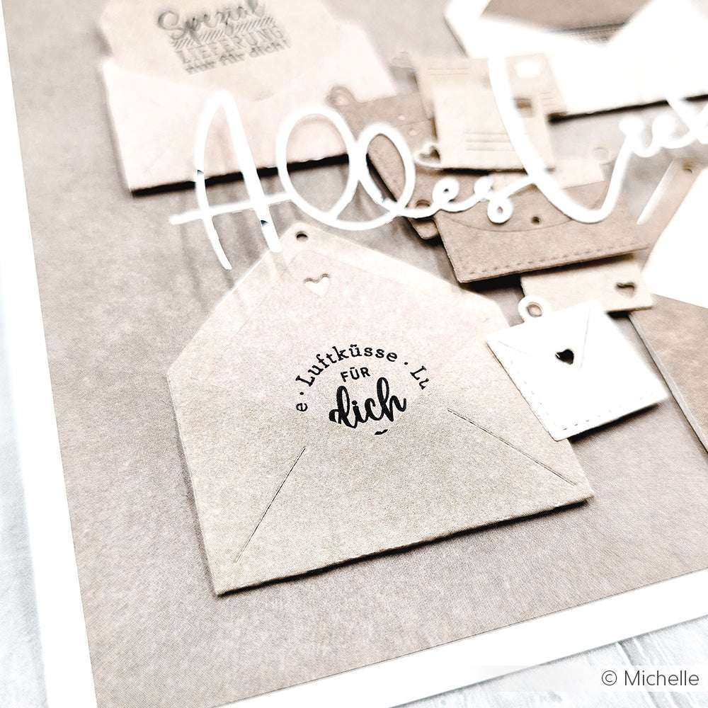 Eine Nahaufnahme der kleinen Papierumschläge von Alexandra Renke, einer mit der Aufschrift Luftküsse für dich - ideal für Papierprojekte oder zum Hinzufügen Ihrer Lieblingsmotive mit Clear Stamp oder Photopolymer Stempel.