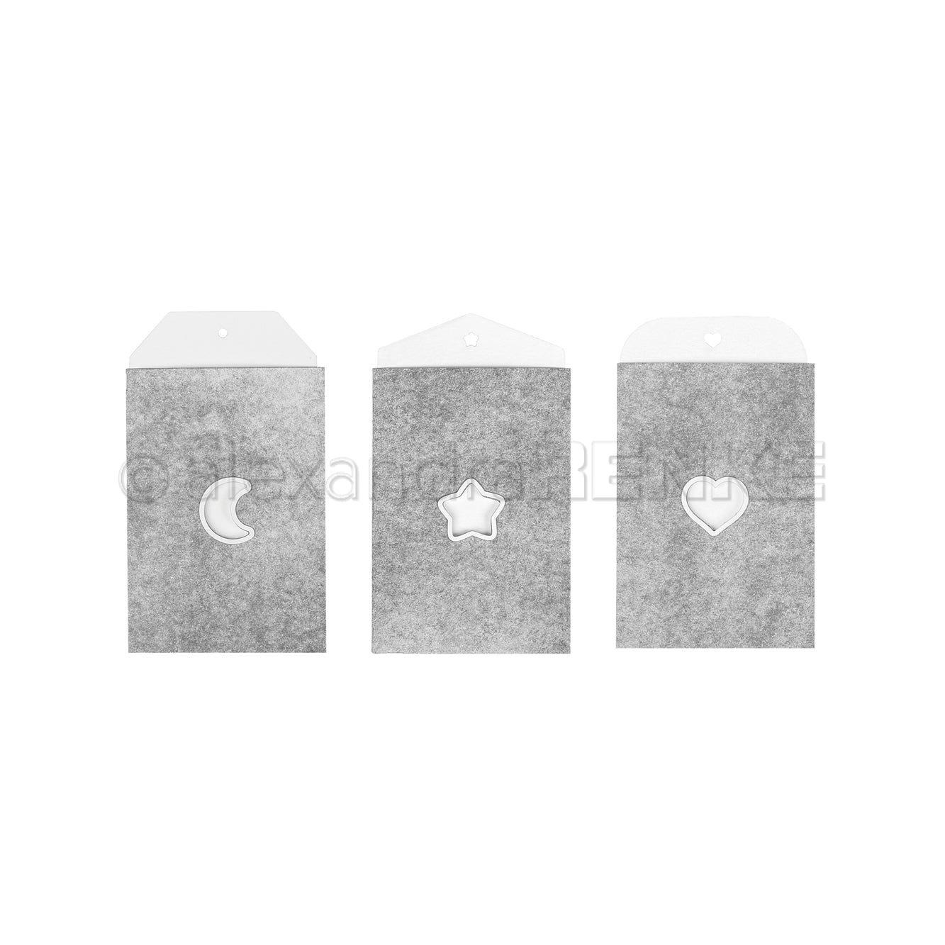 Drei graue Papiertüten von Alexandra Renke mit mond-, stern- und herzförmigen Ausschnitten bringen Kreativität in jeden Raum, schön gebündelt auf weißem Hintergrund.