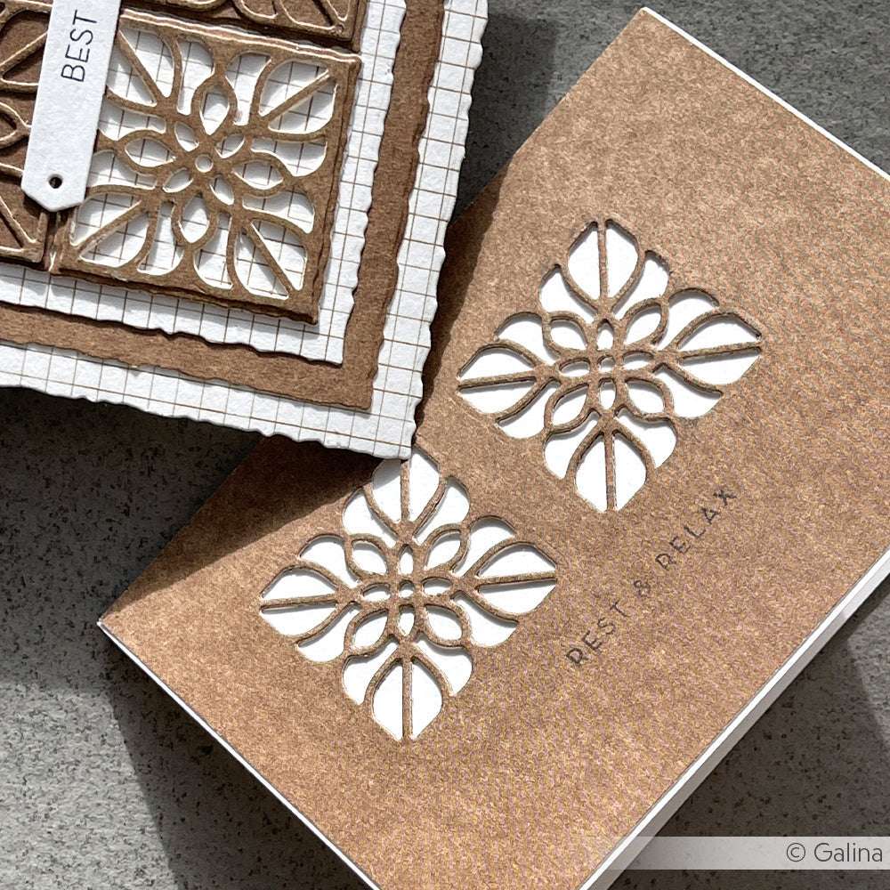 Zwei handgefertigte Alexandra Renke-Karten aus braunem Designpapier sind mit verschlungenen Motivstanze-Ornamenten und den Sprüchen BEST und REST & RELAX versehen.