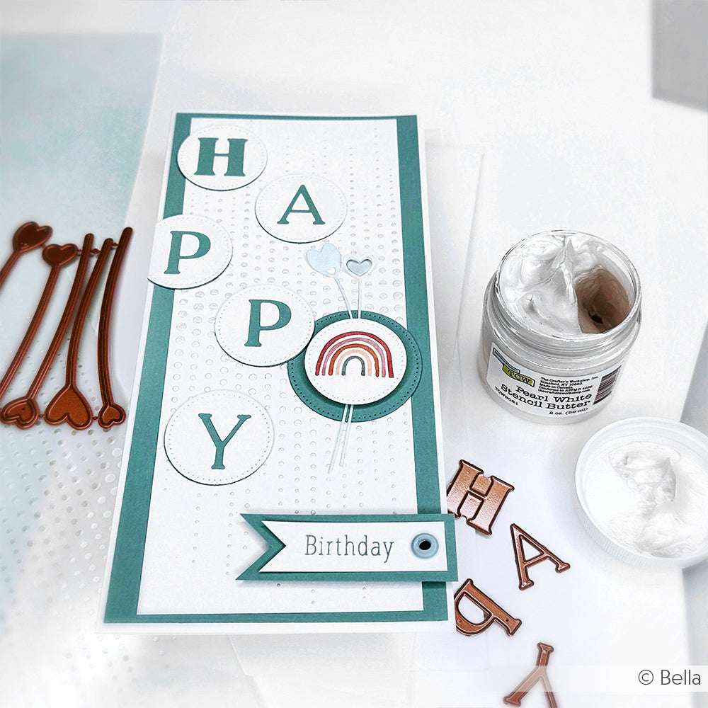 Handgemachte Geburtstagskarte mit den Buchstaben "HAPPY", ausgestanzt mit der Alexandra Renke Motivstanze Gemischtes Alphabet, sowie einem Regenbogen, Herz-Akzenten und Bastelmaterial.