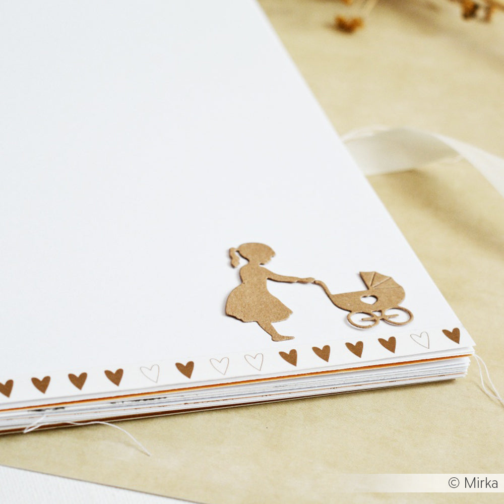 Brauner Papierausschnitt eines Mädchens, das einen Puppenwagen schiebt (Alexandra Renke Motivstanze Mädchen mit Puppenwagen), auf einer weißen Karte, verziert mit kleinen braunen Herzen - ideal für kreative Projekte mit Stanzen für Papier.