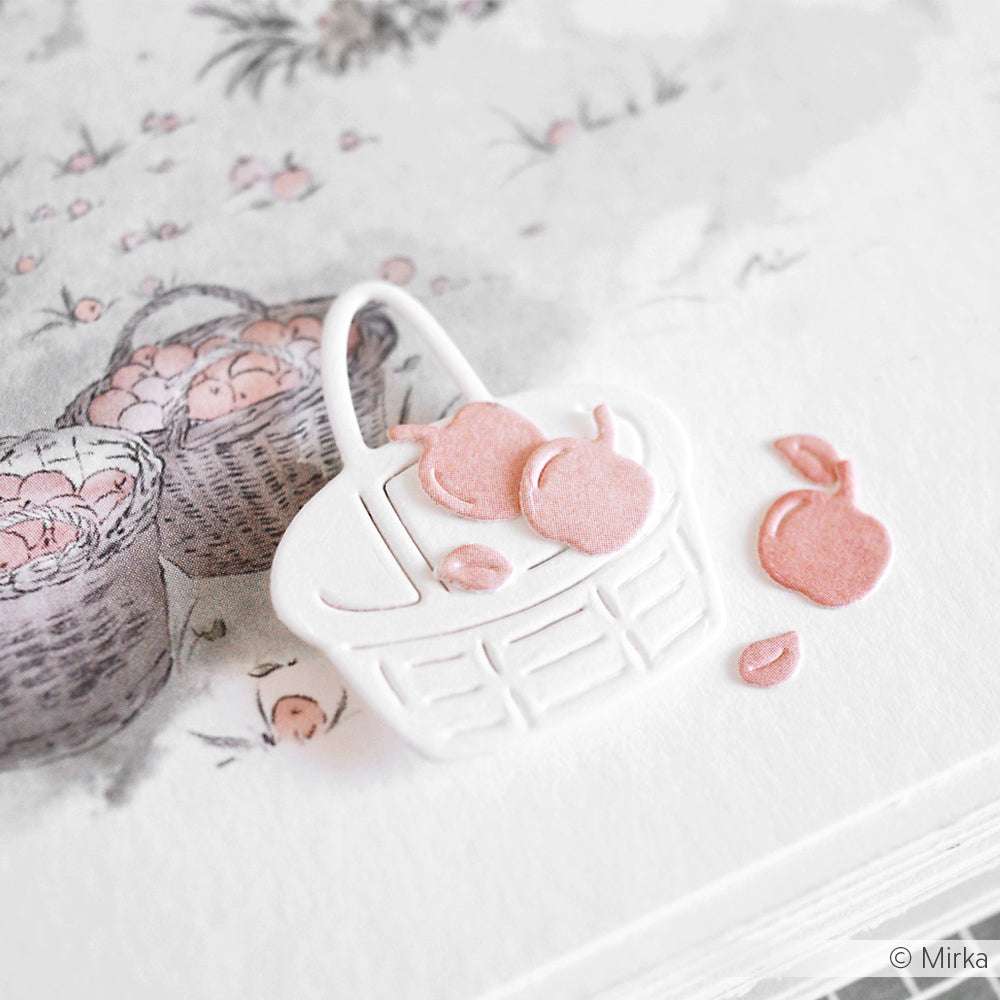 Ein weißer Papierkorb von Alexandra Renke mit rosafarbenen Fruchtausschnitten sitzt auf einer Zeichnung von Körben, die mit passenden Früchten gefüllt sind, alle aus hochwertigen Designpapieren.