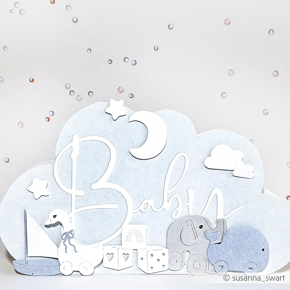 Der Papierausschnitt von Alexandra Renke zeigt den Text "Baby", den Mond, die Wolken, den Elefanten, die Ente, das Segelboot und pastellfarbene Blöcke auf weißem Hintergrund - ideal für kreative Projekte mit Designpapieren.