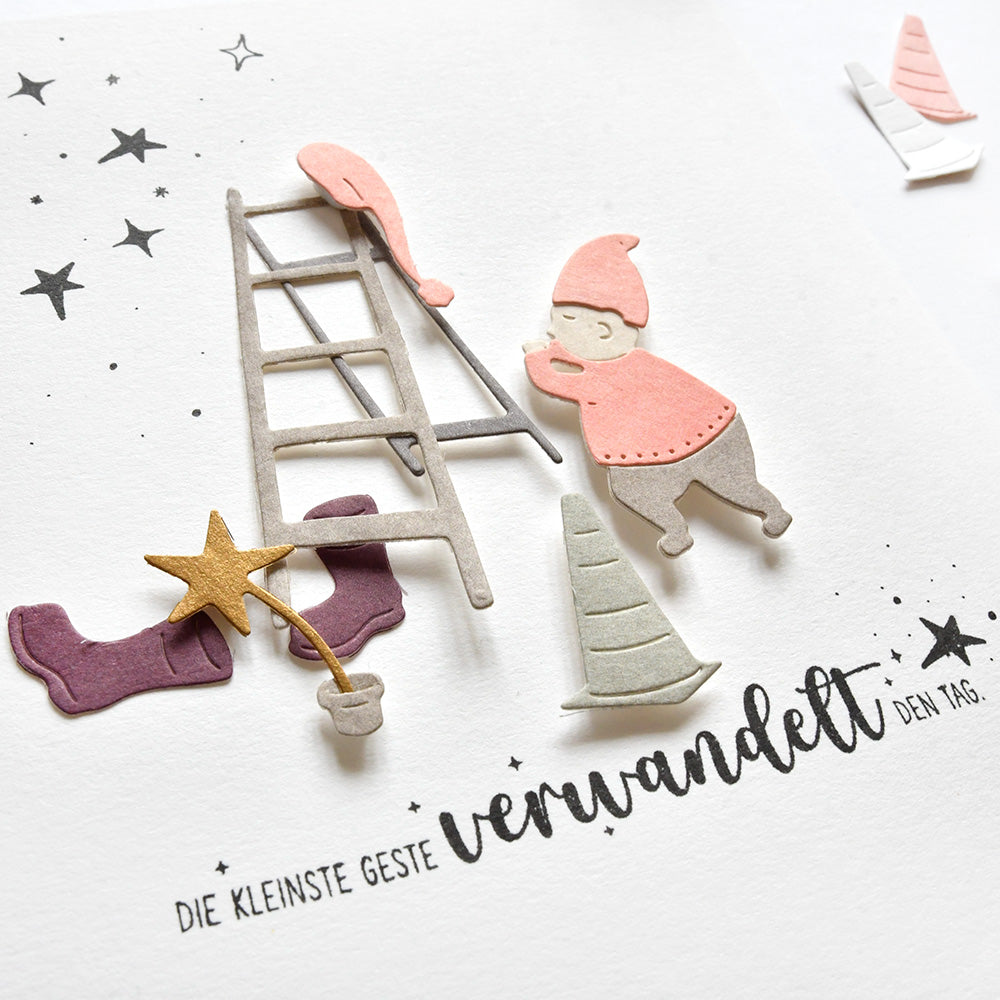 Papierausschnitte von einem Gnom, einer Leiter, einem Stern, Hüten mit deutschem Text und Sternen - perfekt für Alexandra Renke Designpapiere oder zur Verwendung mit der Motivstanze Wichtel bei der Arbeit Stanzsysteme in Ihrem nächsten Bastelprojekt.