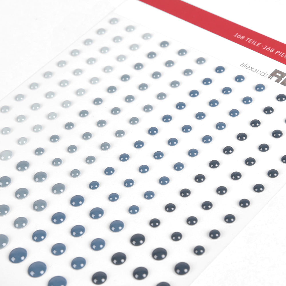 Alexandra Renke selbstklebende schwarze und kosmosblaue Googly Eyes in verschiedenen Größen auf weißem Untergrund, ideal zum Basteln von Karten oder zum Verzieren von verspielten Details.