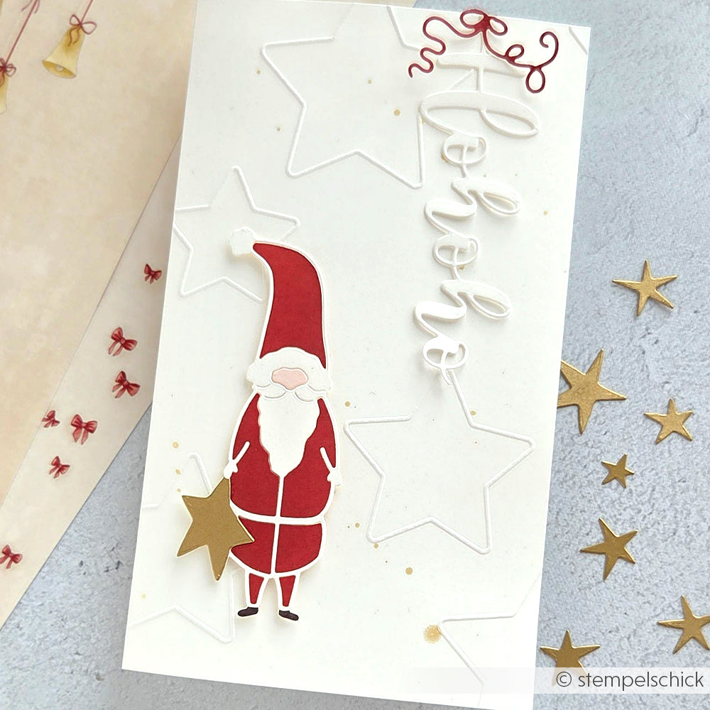 Die handgefertigte Weihnachtskarte von Alexandra Renke zeigt einen roten Weihnachtsmann, goldene und weiße Sterne, den Text "hohoho" auf Weiß und zarte Sterne Outline-Details, die mit Cut & Emboss hergestellt wurden und für zusätzliche Struktur und Charme sorgen.
