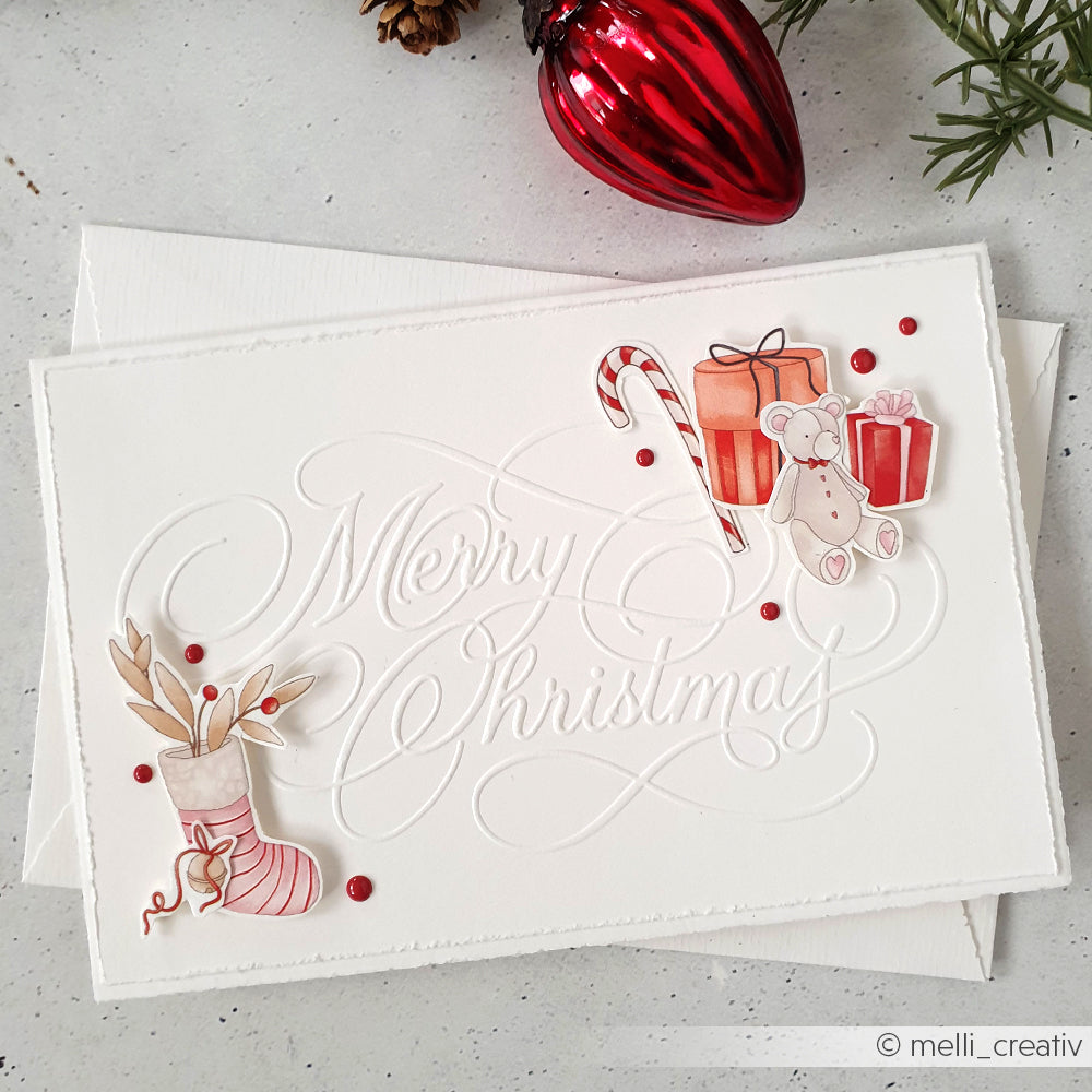 Handgefertigte Weihnachtskarte von Alexandra Renke mit Geschenken, einem Bären, einer Zuckerstange und einem Strumpf mit roten Akzenten, hergestellt mit DieCut Systemen für zusätzliche Details.