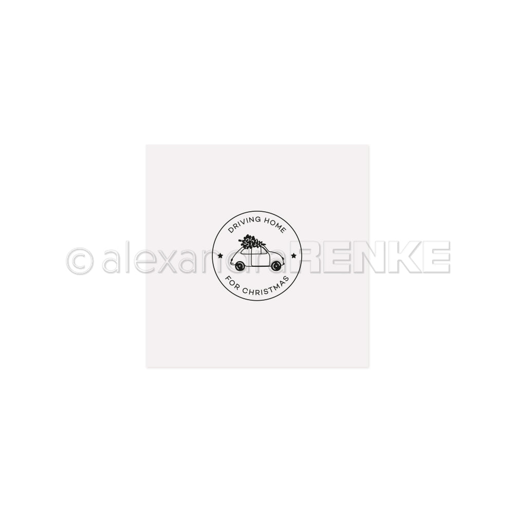 Minimalistische Illustration eines Autos mit einem Weihnachtsbaum und "DRIVING HOME FOR CHRISTMAS" in einem Kreis von Alexandra Renke - ideal, um Ihren Cut & Emboss Folder oder Stanzsystemen einen festlichen Charme zu verleihen.