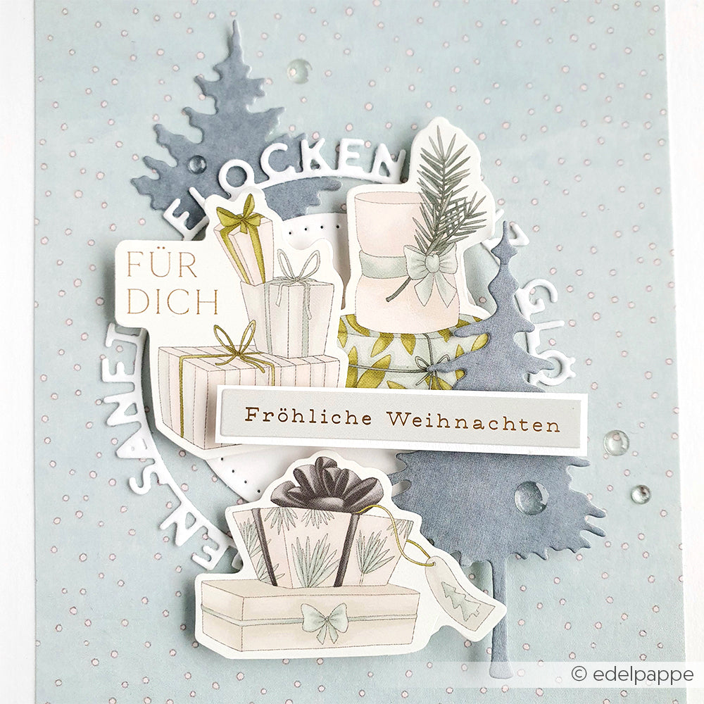 Weihnachtskarte von Alexandra Renke mit Geschenken, Tannenbäumen und deutschen Weihnachtsgrüßen auf hellblauem, gepunktetem Hintergrund - ideal, um Papertie-Projekte oder Papierelemente in Ihre festlichen Basteleien einzubauen.