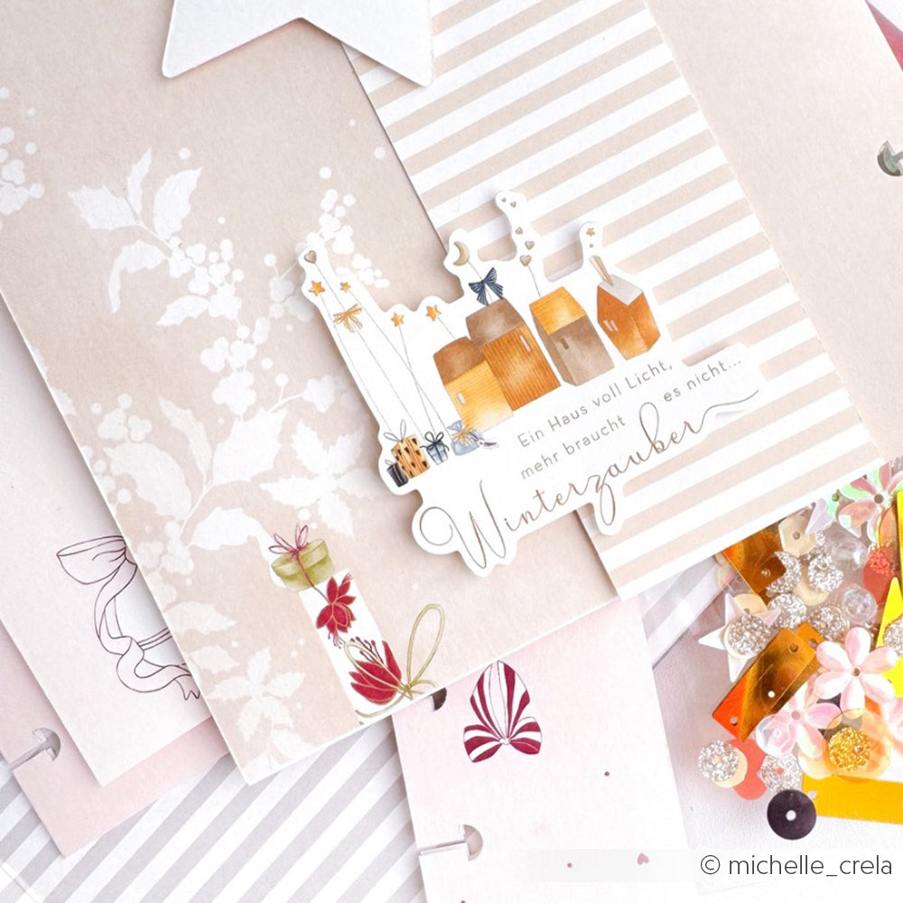 Eine festliche Karte von Alexandra Renke mit Geschenken, Sternen, Blumen, deutschem Text, Pailletten und floralen Motiven - ideal für Papertie-Projekte oder zur Aufwertung Ihrer Sammlung von Ephemera und Papierelementen.