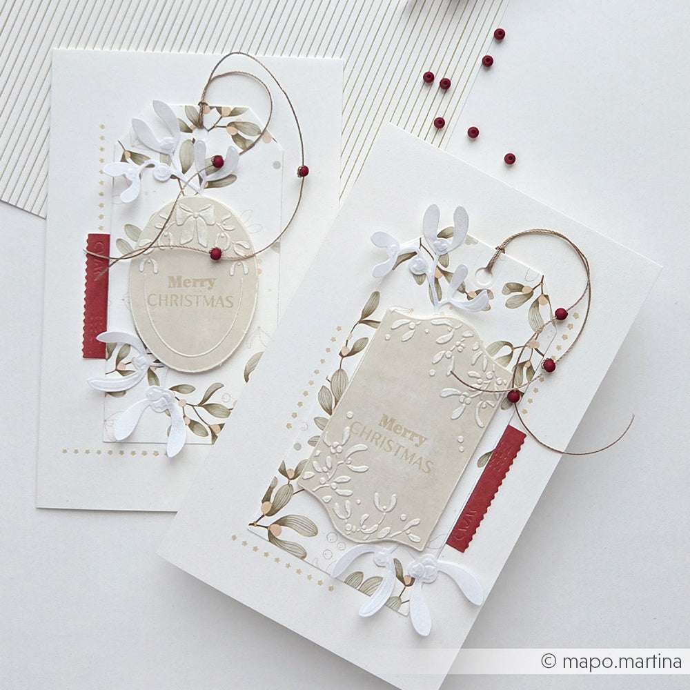 Zwei handgefertigte Weihnachtskarten mit Illustrationen von Florale Etiketten Misteln und festlichen Texten.