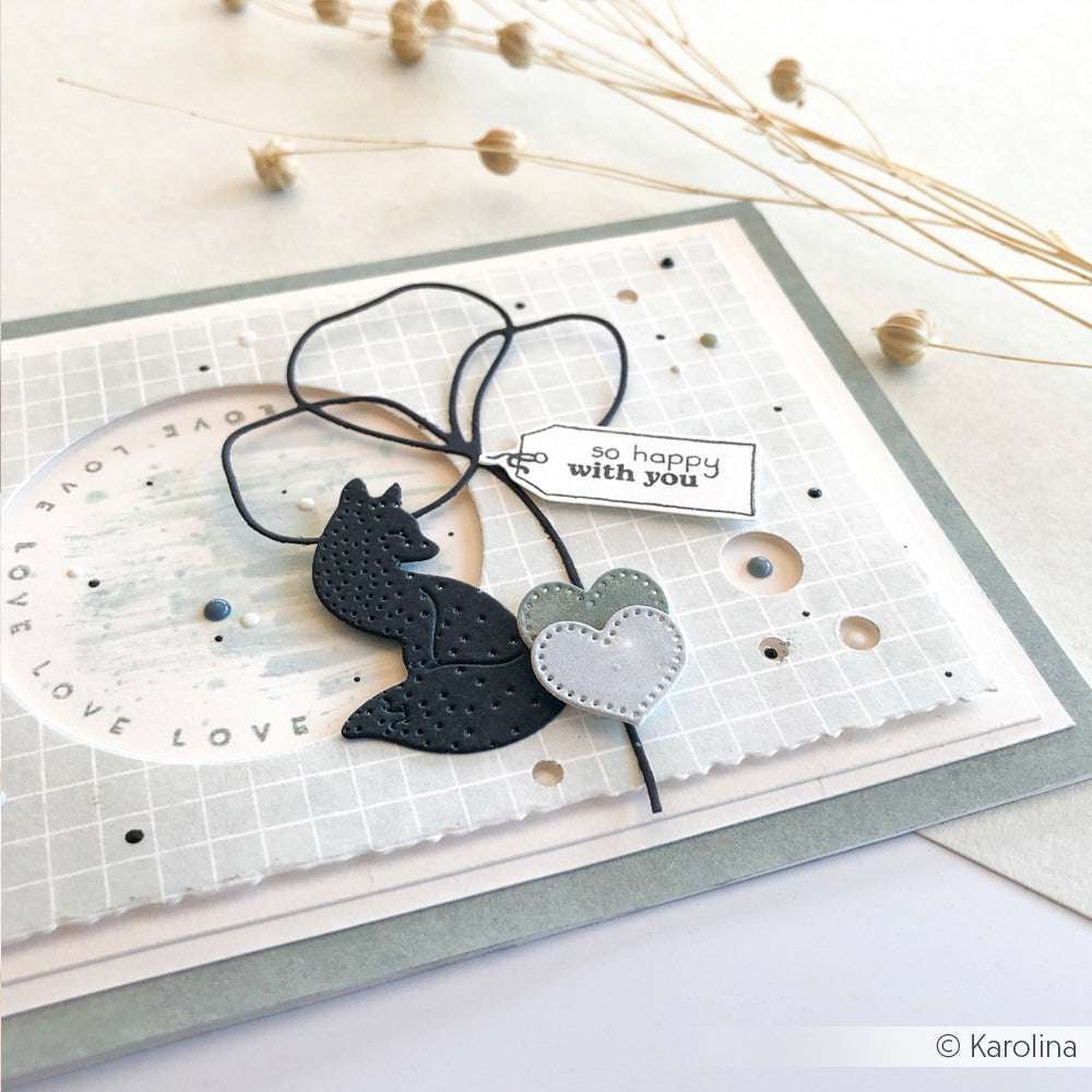Handgemachte Karte von Alexandra Renke mit einem schwarzen Fuchs, einem Herz und einem "So happy with you"-Anhänger, hergestellt mit DieCut Systeme auf einem weichen grauen und weißen Hintergrund.