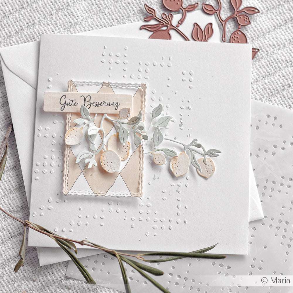 Handgemachte Karte mit gestanzten Zitronenzweigen von Alexandra Renke, einer "Gute Besserung"-Notiz, elegantem Designerpapier und einem weißen Umschlag.