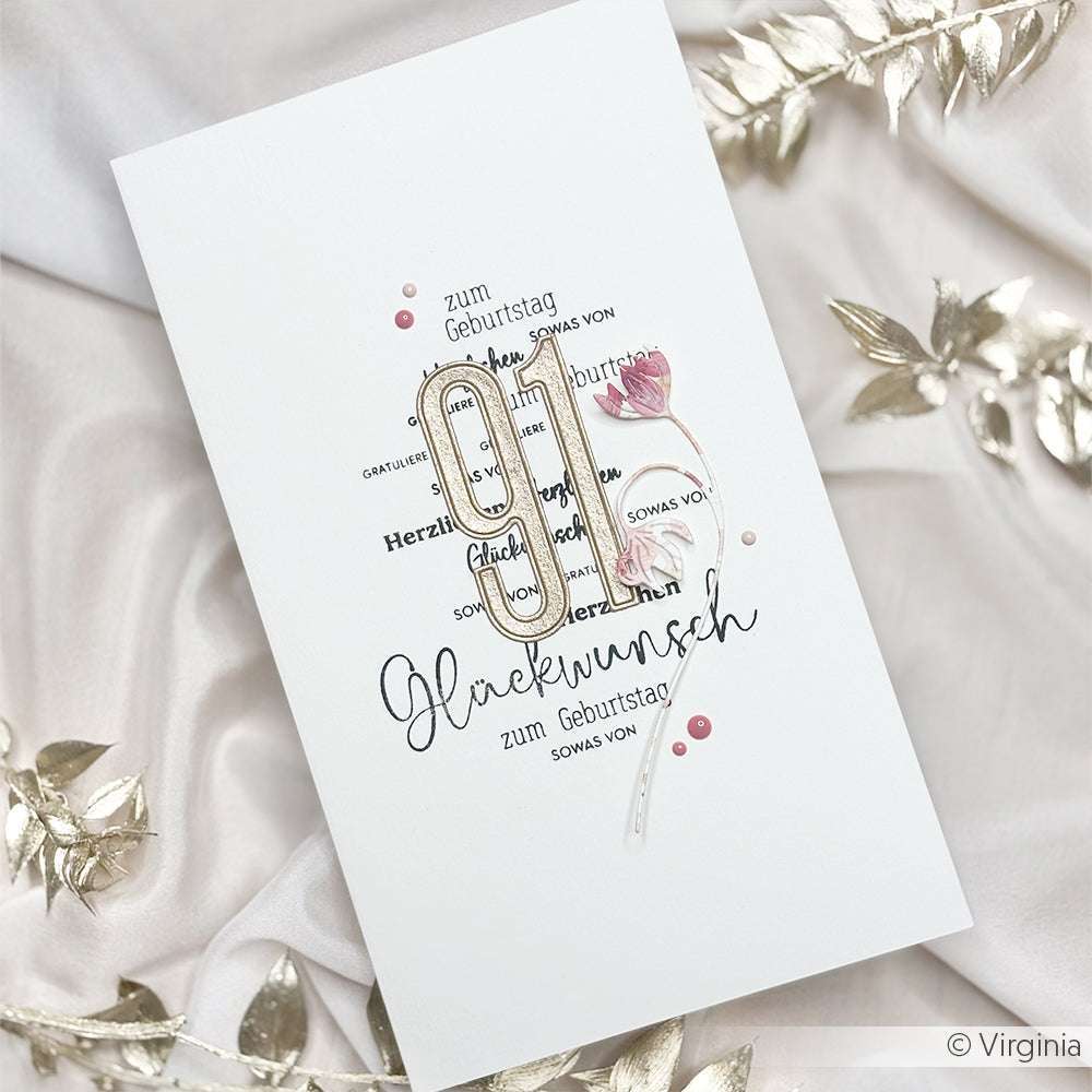 Handgemachte deutsche Geburtstagskarte von Alexandra Renke mit "91" und einer rosa Blume, hergestellt mit Designpapieren und Motivstanze Fransenblume, akzentuiert mit goldenen Blättern auf weißem Hintergrund.