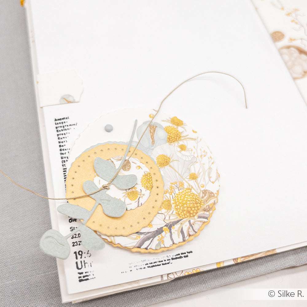 Handgefertigte Karte mit geschichteten gelben und weißen Kreisen, Blattausschnitten mit Alexandra Renke Motivstanze Eukalyptus Trio und zarten gedruckten floralen Mustern auf hochwertigen Designpapieren.