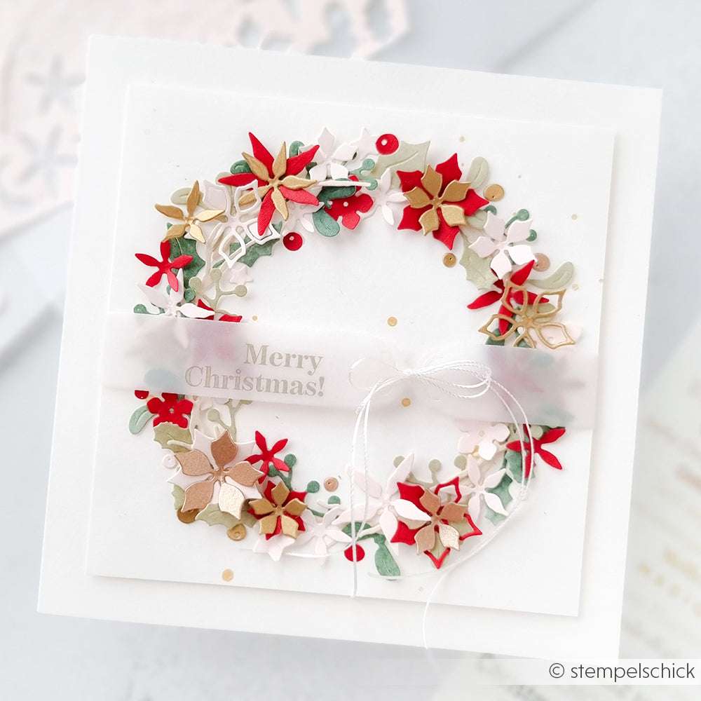 Quadratische Weihnachtskarte von Alexandra Renke mit einem farbenfrohen Blumenkranz, goldenen Akzenten und "Merry Christmas!" auf durchsichtigem Band, hergestellt mit DieCut Systemen und Designpapieren aus der Motivstanze Weihnachtliche Blumensammlung.