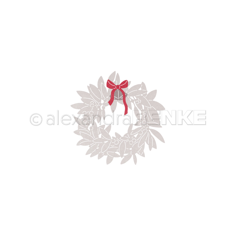 Ein schlichter grauer Adventskranz, gefertigt mit der Alexandra Renke Motivstanze Blätterkranz und gekrönt mit einer roten Schleife, steht mittig auf einem weißen Hintergrund.