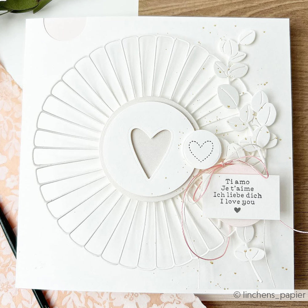 Handgefertigte weiße Karte von Alexandra Renke mit einem Herzausschnitt, eleganten floralen Designpapieren und der Aufschrift "Ti amo, Je t'aime, Ich liebe dich". Hergestellt mit DieCut Systemen für exquisite Details.