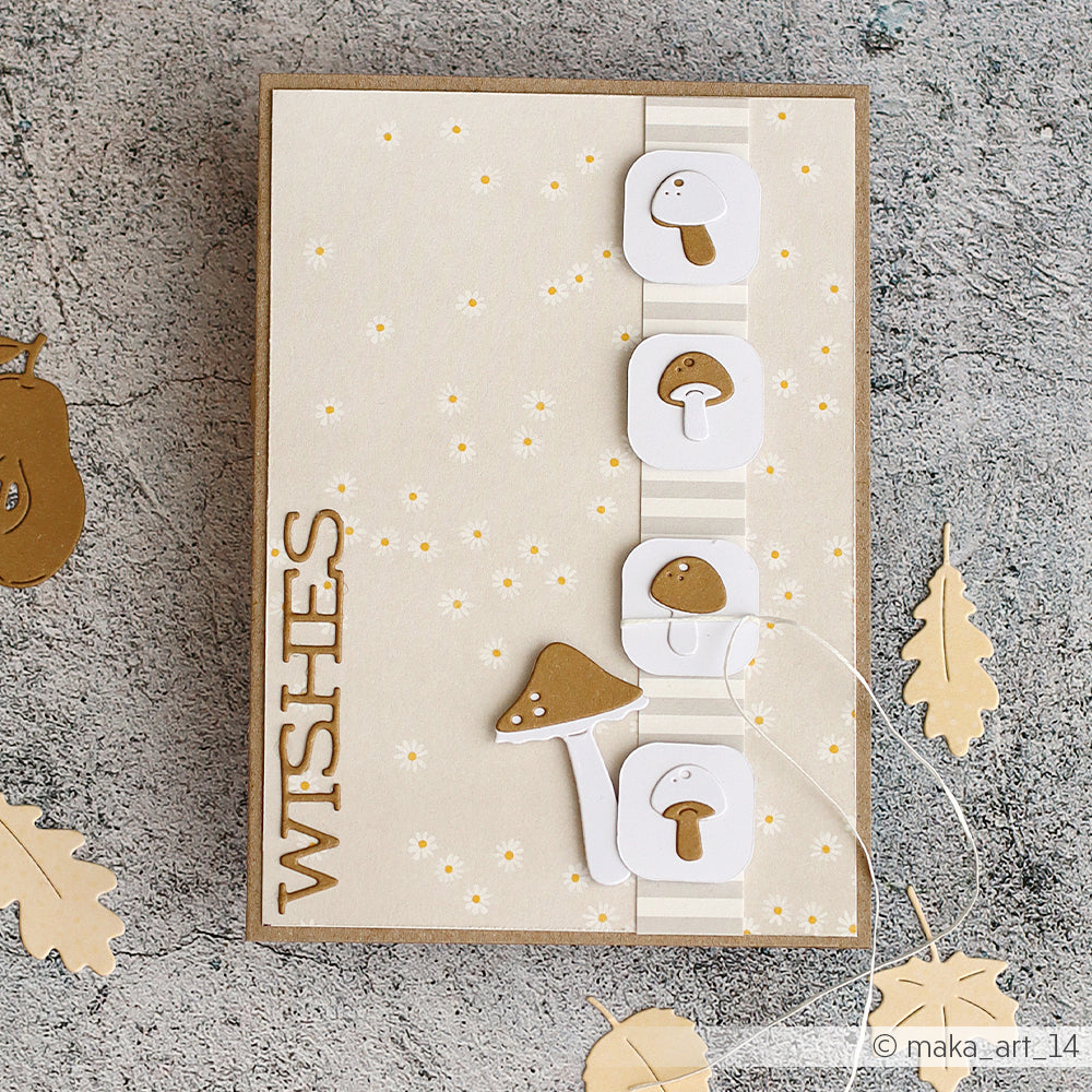 Handgefertigte Grußkarte mit Pilzen, die mit der Motivstanze „Pilz Trio“ gestanzt wurden, dem Schriftzug „WISHES“ und beigen Papierblättern aus hochwertigen Designpapieren auf strukturierter Oberfläche – ideal, um kreative Stanzsysteme-Techniken zur Geltung zu bringen.