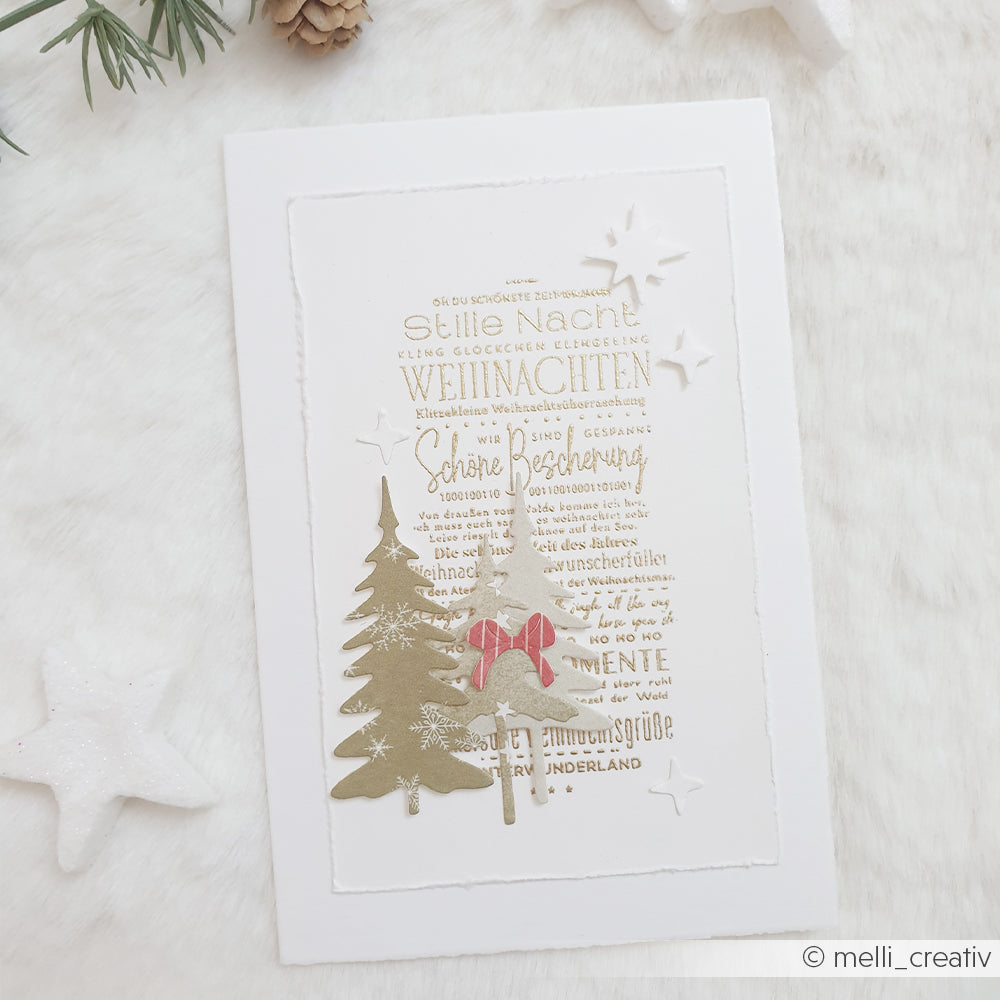 Weihnachtskarte mit deutschem Text, zwei Motivstanzungen Kleine Tannen und einer kleinen roten Schleife.