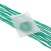 ☆ Grüne Kordeln aus Seidenschnur, kombiniert mit einem durchscheinenden, handgenähten Beutel mit den Aufschriften „SOMETHING“ und „Alexandra Renke“ – ideal für stilvolle Geschenkverpackungen – alles elegant vor weißem Hintergrund präsentiert.