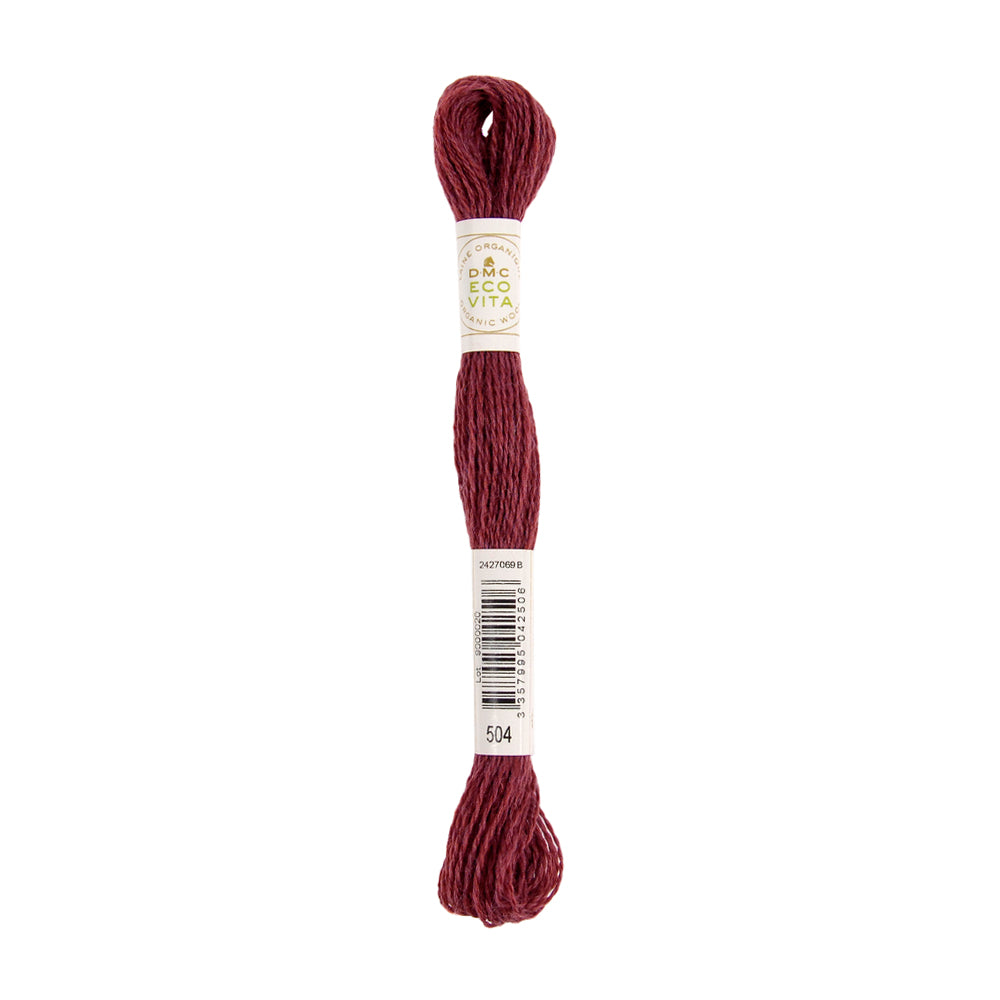 Ein Knäuel kastanienbraunes Stickgarn der Marke DMC Eco Vita mit einem Barcode und der Nummer 504, hergestellt aus natürlich gefärbtem Garn, ideal für filigrane Stickprojekte.