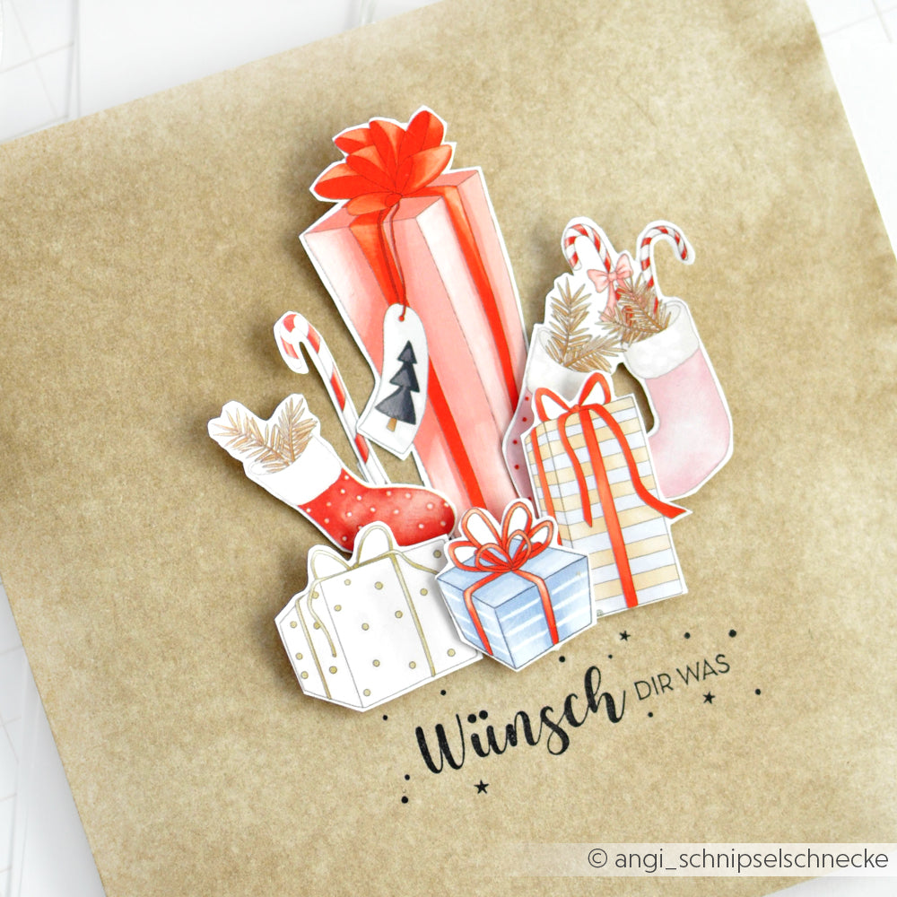 Illustration von Weihnachtsgeschenken, Strümpfen und Zuckerstangen auf braunem Papier mit "Wünsch dir was" - die perfekte Inspiration für Papierprojekte oder Gestaltungen mit Stempelkissen und Holzstempel von Alexandra Renke.