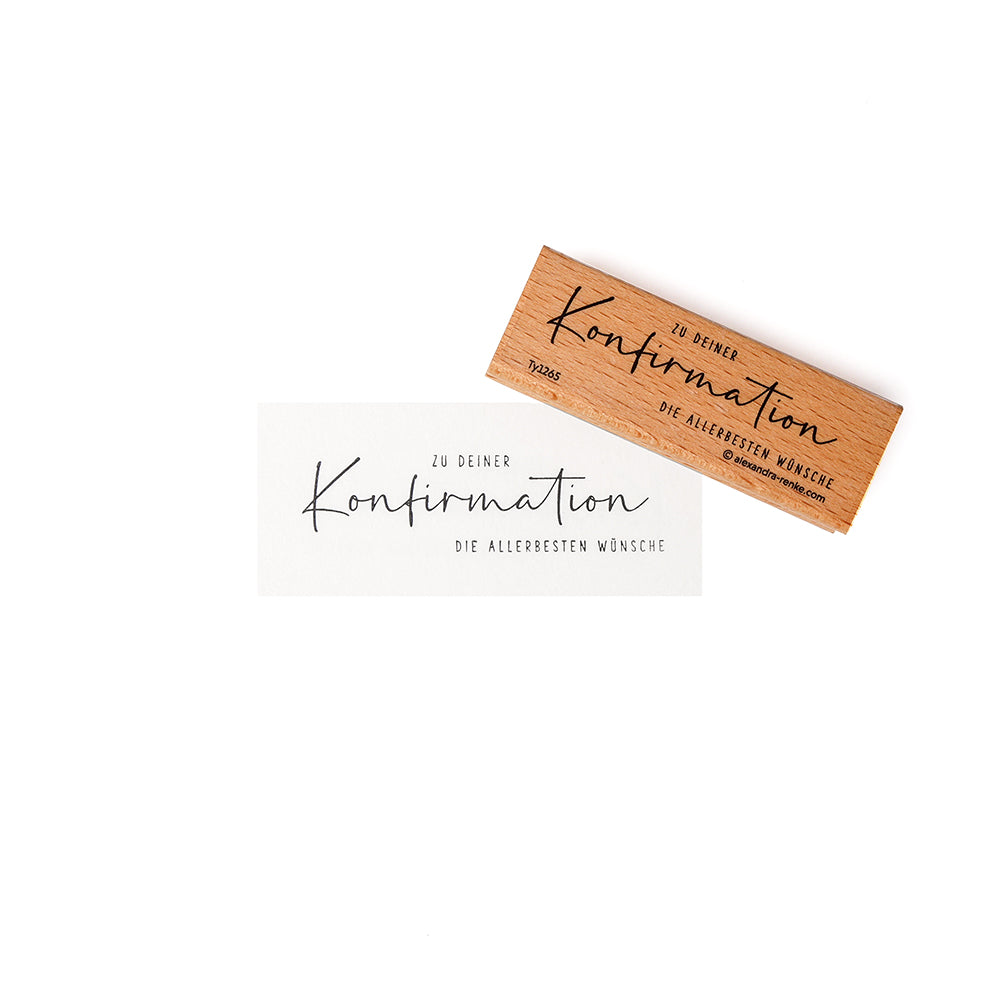 Alexandra Renke Holzstempel und weiße Karte zeigen den deutschen Text "Konfirmation - Die allerbesten Wünsche". Dieser Holzstempel Konfirmation ist ideal für die Verwendung mit einem Stempelkissen.