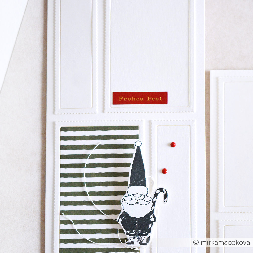 Eine minimalistische Weihnachtskarte von Alexandra Renke mit einer Weihnachtsmann-Illustration, dem Text "Frohes Fest" und grünen Streifen - perfekt für die Personalisierung mit einem Stempelgummi oder einem klassischen Holzstempel-Design.
