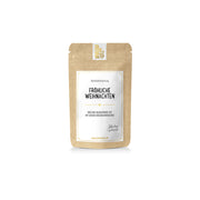 Ein Beutel „Tatetata“ – eine winterliche Teemischung, ein Rooibos-Tee mit der Aufschrift „Fröhliche Weihnachten“.
