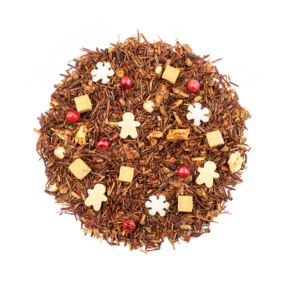 Weihnachtstee als loser Tee mit Rooibos, Lebkuchenmännchen, Schneeflocken und roten Beeren.