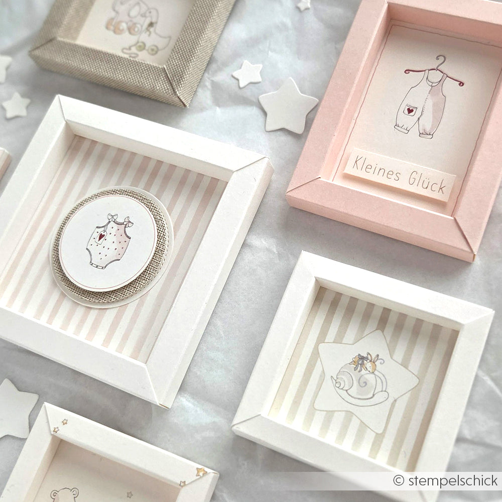 Gerahmte Baby-Kunst in Pastellfarben mit Sterndekorationen von Alexandra Renke - die perfekte Inspiration für Papierprojekte wie Grußkarten oder einzigartige Anwendungen von Designpapier.