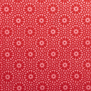 Rotes und rosa geometrisches Blumenmuster mit kreisförmigen Motiven auf einer glatten Oberfläche – ideal zum Verpacken von Geschenken oder zum Basteln mit nachhaltigem Nepalpapier von ☆.