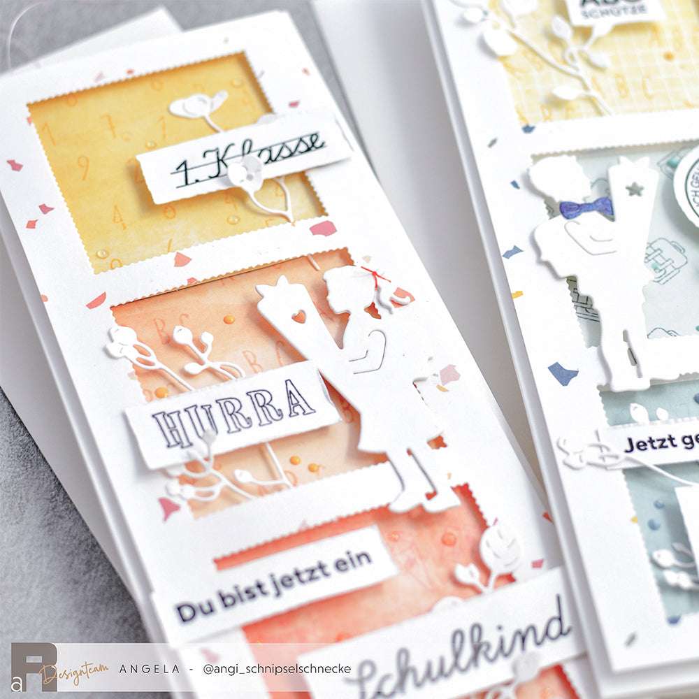 Die handgemachten Grußkarten von Alexandra Renke zeigen Kindersilhouetten, deutsche Texte und orange-blaue Hintergründe. Erstellt mit Motivstanze Mädchen mit Schultüte dies und Stanzsysteme für einzigartige Formen.