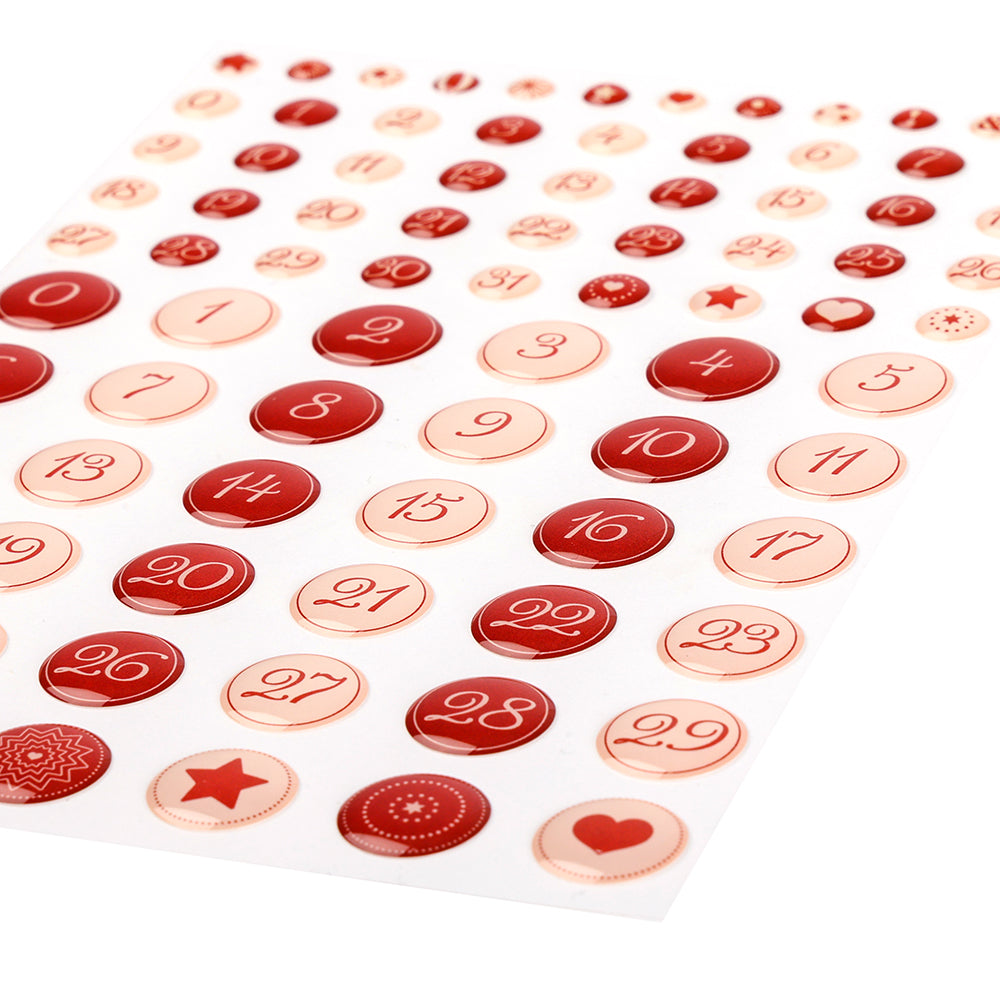 Ein Bogen kalligrafischer roter und rosafarbener Sticker Dots von Alexandra Renke, nummeriert von 1-31, mit einigen Kreisen mit kleinen Symbolen - perfekt für die Gestaltung von Karten oder Planern.
