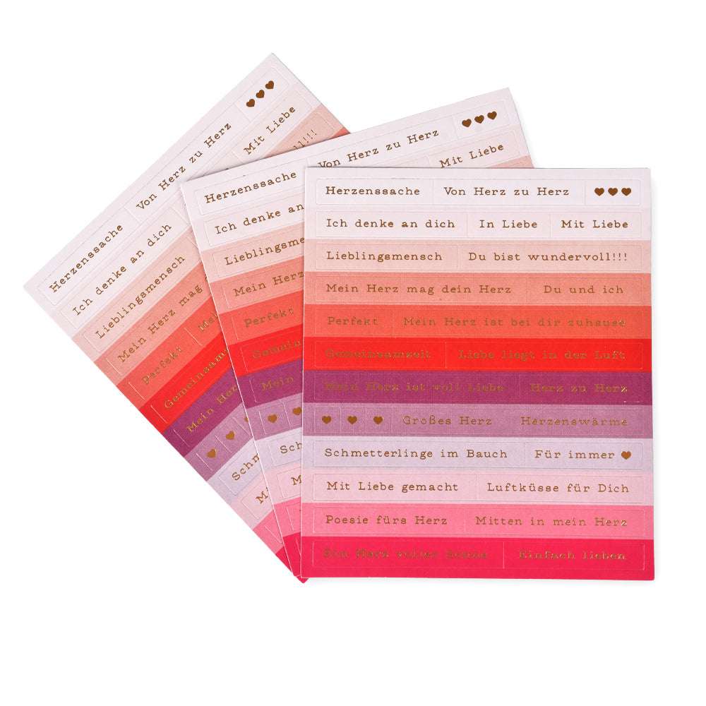 Vier Bögen rechteckiger Sticker-Streifen von Alexandra Renke in Rosa-, Rot- und Orangetönen mit deutschem Goldfolientext - ideal für die Gestaltung von Karten oder Geschenken.
