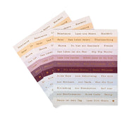 Drei Bögen mit farbenfrohen deutschen Sprüchen von Alexandra Renke, perfekt zum Verzieren oder Kartengestalten. Mit festlichen Wörtern wie Feierlaune und Beste Wünsche für Feste.