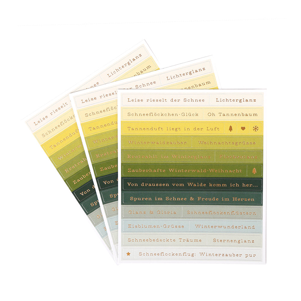 Drei Bögen der dekorativen grün-goldenen Sticker-Streifen von Alexandra Renke mit weihnachtlichen und winterlichen Sprüchen - ideal für die Gestaltung von Karten oder um einen Hauch von Winterwaldzauber in Ihre Projekte zu bringen.