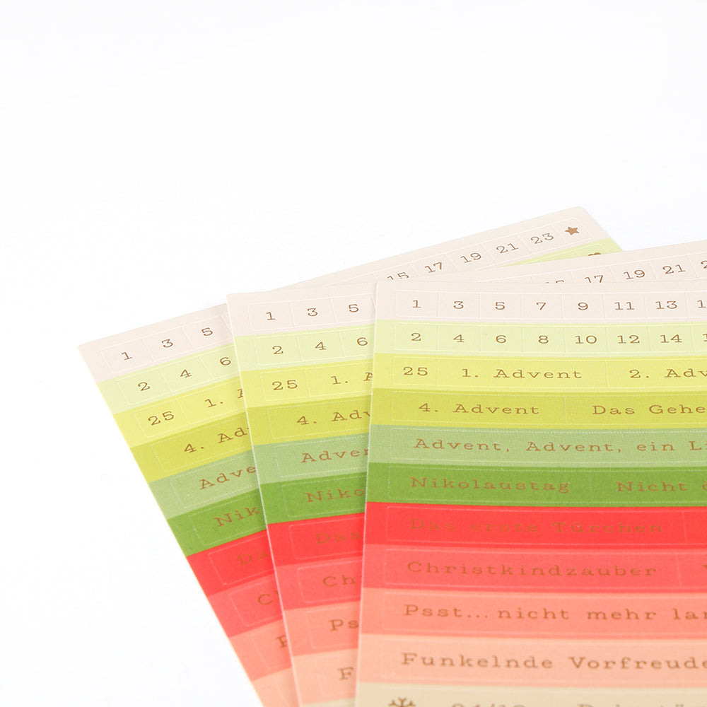 Vier Bögen Alexandra Renke Adventszauber Sticker-Streifen, nummeriert und beschriftet, ideal zur festlichen Organisation oder für Kartengestaltung auf weißem Hintergrund.