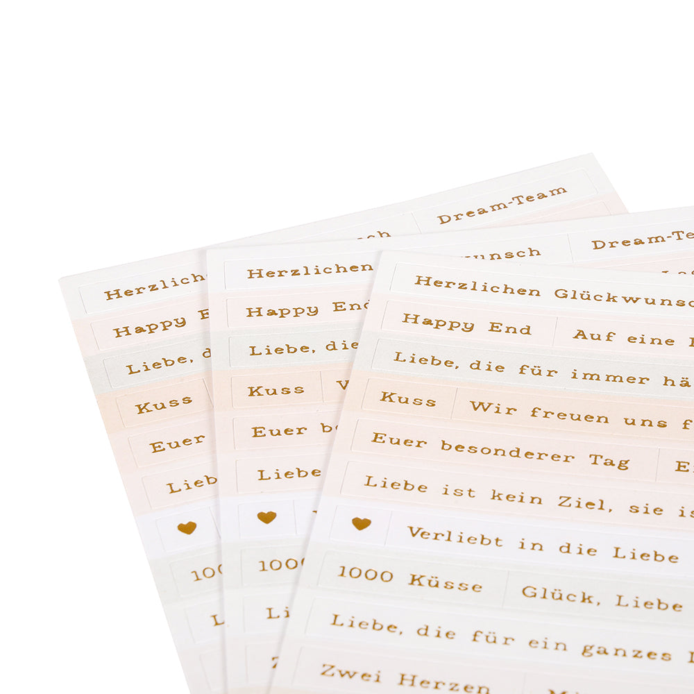 Die goldenen und weißen Alexandra Renke Sticker Streifen sind mit deutschen und englischen Sprüchen wie "Herzlichen Glückwunsch" und "Happy End" versehen - ideal für die Gestaltung von Karten oder zum Hinzufügen von Aufklebern mit Hochzeitswünschen.
