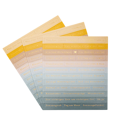Vier Bögen Alexandra Renke pastellfarbener Sticker-Streifen mit goldgeprägten deutschen Sprüchen - ideal zur Kartengestaltung und um Ihren kreativen Projekten Meeresbrise-Charme zu verleihen.