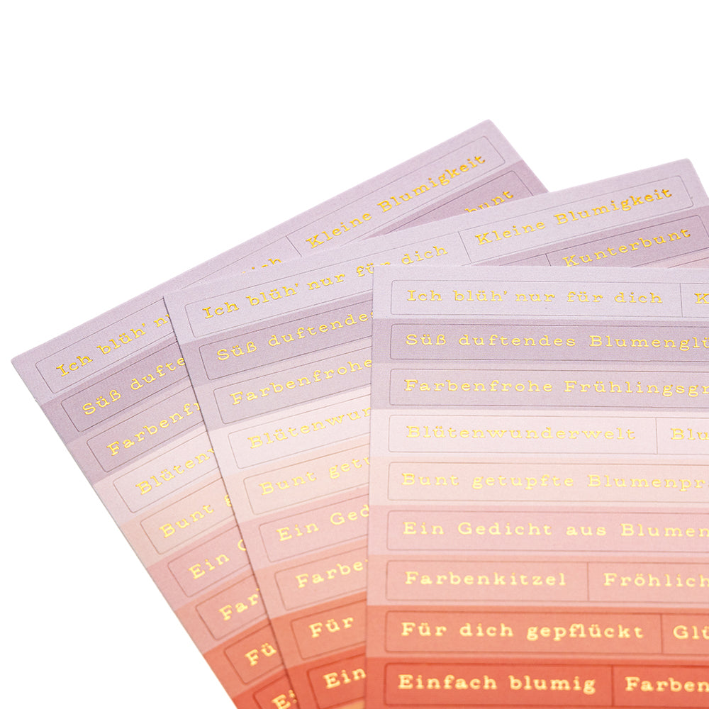 Drei Bögen rechteckiger pastellfarbener Sticker-Streifen von Alexandra Renke mit deutschem Text in Goldfolie, perfekt zur Kartengestaltung und zum Hinzufügen eines Hauchs von Farbenzauber zu Ihren Bastelarbeiten.