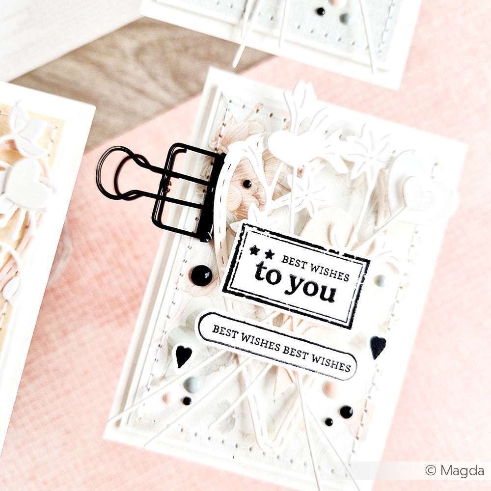 Eine handgefertigte weiße Karte von Alexandra Renke mit den besten Wünschen für Sie, Clear Stamp-Motiven, Ausschnitten, Schnur und einem schwarzen Clip - ideal für einzigartige Papierprojekte.