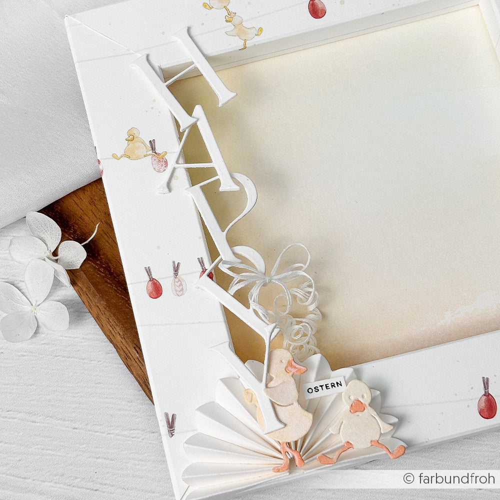 Weißer Fotorahmen mit den Buchstaben HAI, zwei niedlichen Enten und frühlingshaften Details - erstellt mit der Motivstanze Alphabet Dezember von Alexandra Renke.